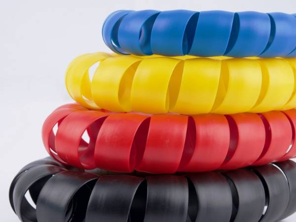Colorful plastic spiral warp protectors are displayed.
